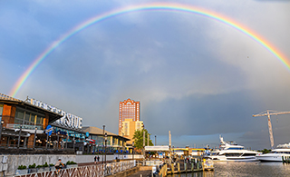 Waterside District waterfront with a rainbow